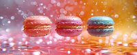 Colorful macarons floating in water with bokeh effect background in pink, orange and yellow gradient colors. Perfect for food advertising.