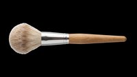 Soft bristle makeup brush with natural wooden handle and metal ferrule, isolated on transparent background. Ready for beauty product design, cosmetics packaging, tutorials, and print-on-demand applications.