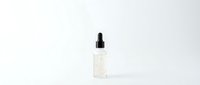 Clear glass dropper bottle with black pipette cap on white background for skincare and cosmetic product mockups.