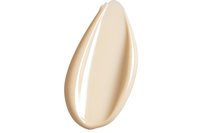 Smooth cream foundation smear isolated on white background, showing liquid makeup texture and natural beige tone for cosmetic product presentation.