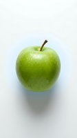 Fresh green apple with water droplets isolated on white background, ready for food and nutrition design projects.