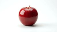Fresh red apple with glossy skin isolated on white background, ready for healthy eating, nutrition, and food design projects.