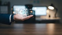 Businessman hand holding glowing digital globe with network connections in modern office environment for technology and global business concepts.
