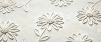 Elegant white embroidered daisy flowers on natural linen fabric texture. Delicate floral needlework pattern for home decor, fashion design and craft projects.