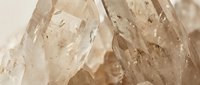 Clear quartz crystal clusters with natural geometric formations and translucent surfaces, suitable for mineral, geology, and wellness content.
