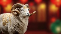 Majestic ram with curved horns against festive bokeh lights background for holiday greeting cards and seasonal marketing materials.