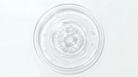 Clear gel or serum swirls in circular motion on white background, isolated cosmetic product texture for skincare packaging and beauty design use.