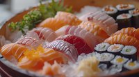 Fresh assorted sushi and sashimi platter with salmon, tuna, and maki rolls served on crushed ice, garnished with ginger and wasabi for Japanese cuisine.