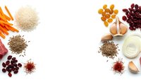 Colorful spices, grains and ingredients arranged in circular border on white background with copy space for culinary design projects.
