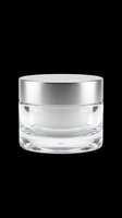 Empty glass cosmetic jar with brushed silver lid, isolated on transparent background, ready for product design, packaging mockups, t-shirt graphics, sublimation, and print-on-demand applications.