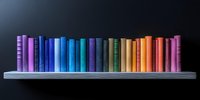 Colorful book spines arranged in rainbow spectrum order on gray shelf against dark background, creating gradient from purple through blue, green, yellow to pink.