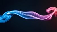 Ethereal smoke trails blend from blue to pink in elegant curves against dark background, creating mesmerizing abstract art suitable for modern design projects.