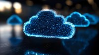 Glowing blue cloud computing symbol with sparkle effect and digital particles against dark background, representing data storage and online technology.