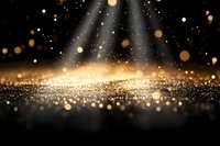 Golden glitter particles and light rays on dark background with bokeh effect and sparkles creating magical atmospheric scene for festive designs.