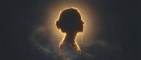 Young woman silhouette with glowing halo light effect against dark starry background for spiritual meditation wellness and mindfulness concepts.