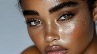 Young African American woman with dewy glowing skin and natural makeup showcasing skincare routine and beauty treatment results for cosmetic advertising.
