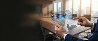 Businessman using transparent tablet with holographic interface displaying digital data analytics in modern office environment for technology presentations.