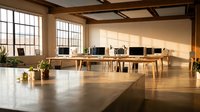 Modern open office workspace with wooden desks, computers and large windows creating bright collaborative environment for business teams.