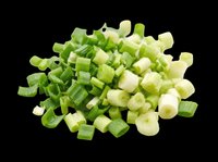 Chopped fresh green onions pile isolated on transparent background, ready for food design, menus, stickers, print on demand, and culinary clipart projects.