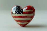 Heart shaped decoration featuring American flag pattern with stars and stripes in red white and blue colors against neutral background, patriotic symbol.