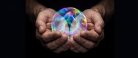 Hands holding glowing crystal ball with colorful light patterns against dark background, representing future vision, fortune telling, and mystical energy for spiritual concepts.