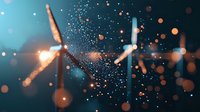 Wind turbines silhouetted against dark sky with glowing bokeh lights and sparkles creating magical atmosphere. Clean energy concept for sustainable future.