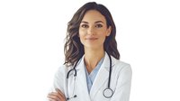 Young female medical professional in white coat and stethoscope smiling confidently with arms crossed against light background. For healthcare and medical advertising.