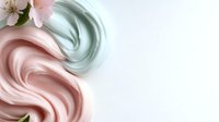 Soft pastel pink and mint green swirled cream texture with delicate flowers on white background for cosmetic and beauty product design applications.