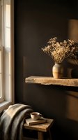Minimalist interior with dried flowers in ceramic vase on wooden shelf, warm sunlight from window, cozy reading nook with book and blanket for home decor and lifestyle design.