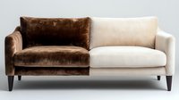 Modern two-tone sofa with brown velvet and beige fabric upholstery on dark wooden legs for contemporary living room interior design and home decor.