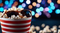 Fresh popcorn in striped red and white container with sunglasses against blurred bokeh lights background, creating cinematic atmosphere for movie night.