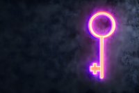 Glowing neon key symbol in purple and yellow colors against dark smoky background, modern minimalist design for security and access concepts.