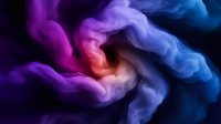 Vibrant swirling smoke in purple, pink and blue colors creating abstract fluid art pattern against black background, dramatic lighting effect highlights motion and flow.