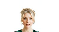 Young woman with blonde braided crown hairstyle and green top, isolated on white background for portrait and design use.