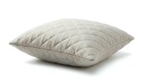 Beige quilted pillow with diamond stitching pattern isolated on white background, soft textile cushion for bedroom decor and interior design.