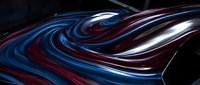 Flowing neon light waves in blue, red, and white colors swirl across dark background. Modern abstract design for digital art, motion graphics, and contemporary visual projects.