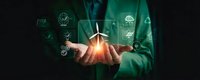 Businessman in green suit holding glowing wind turbine with renewable energy icons floating around, representing sustainable business and clean technology solutions.