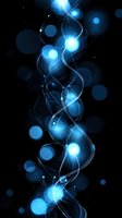 Glowing blue energy waves with luminous bokeh effects on black background create magical light stream pattern for technology and abstract designs.