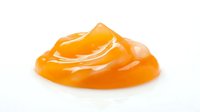 Bright orange gel or slime substance with glossy, translucent texture isolated on white background, suitable for product mockups, cosmetics, skincare, or design projects.