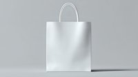 White paper shopping bag with handles on light gray background, isolated mockup for branding and retail design presentation. Clean minimalist style.
