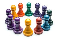 Colorful wooden chess pawns arranged in circle formation on white background, isolated game pieces showcase diversity and teamwork concept for business presentations.