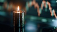 Burning black candle against blurred stock market chart background showing downward trend, creating moody atmosphere for financial concept visualization.
