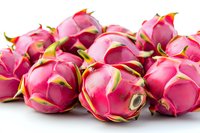 Fresh dragon fruit or pitaya with bright pink skin and green scales arranged in group on white background, macro food photography for healthy eating concept.