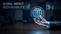 Business professional holding glowing globe hologram representing global impact responsibility and corporate sustainability in modern office environment.