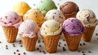 Assorted ice cream scoops in waffle cones featuring various flavors like vanilla, chocolate, strawberry, and pistachio, garnished with chocolate chips on white surface.