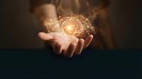 Human hands cupping glowing brain with light bulb symbolizing creativity, innovation and bright ideas for business concepts.