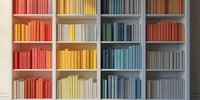 Colorful books arranged by spectrum on white wooden shelves creating rainbow gradient effect, modern minimalist library organization for interior design.