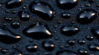 Water drops on dark surface creating abstract pattern with light reflections and shadows. Macro photography showing surface tension and hydrophobic effect.
