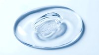 Transparent gel or serum swirl on white background, isolated cosmetic product texture for skincare, beauty, and wellness design applications.