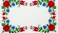Traditional folk art floral border with red roses, blue flowers and decorative swirls on white background for greeting cards, invitations and crafts.